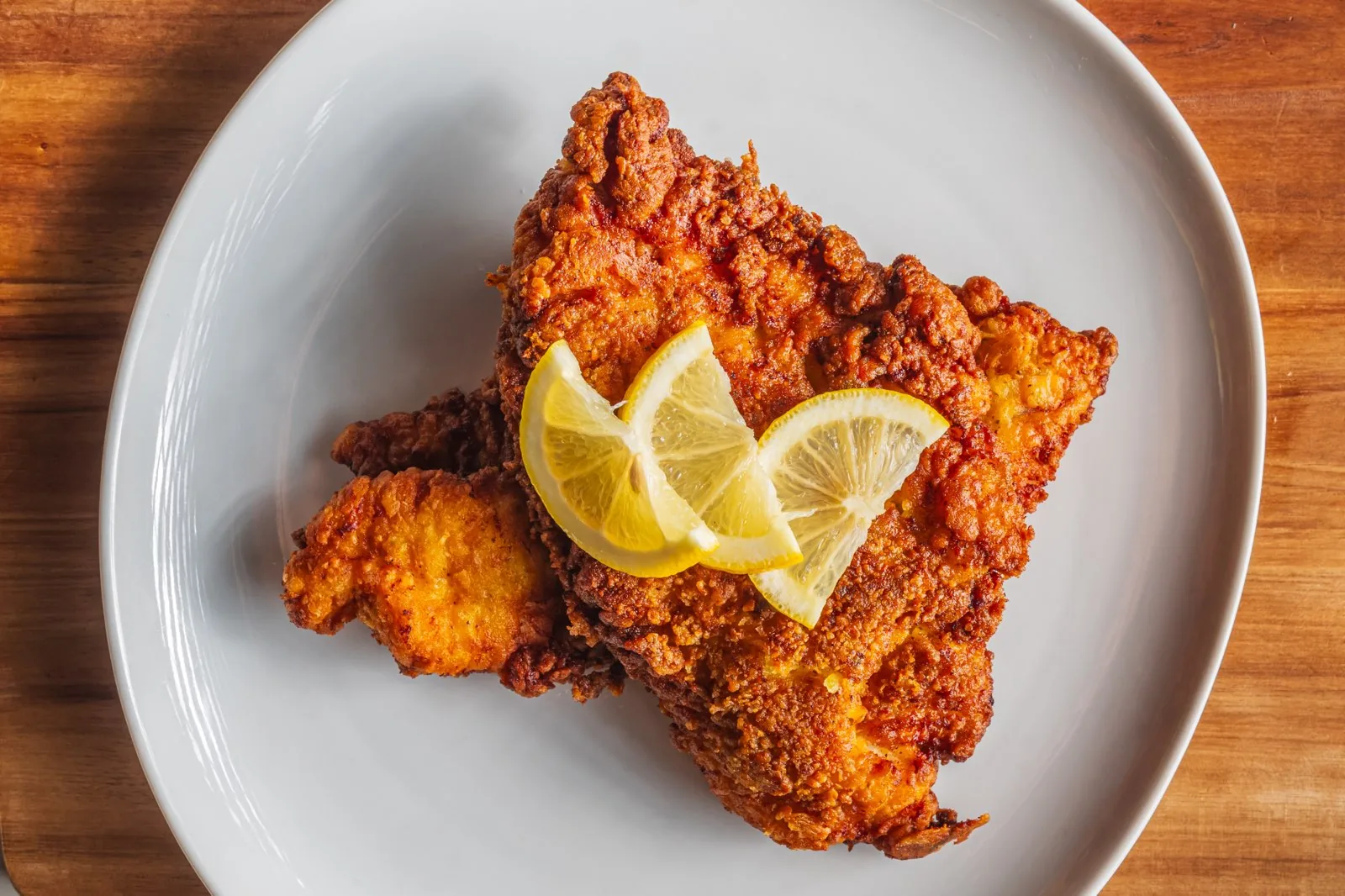 Golden fried plate with lemon slices