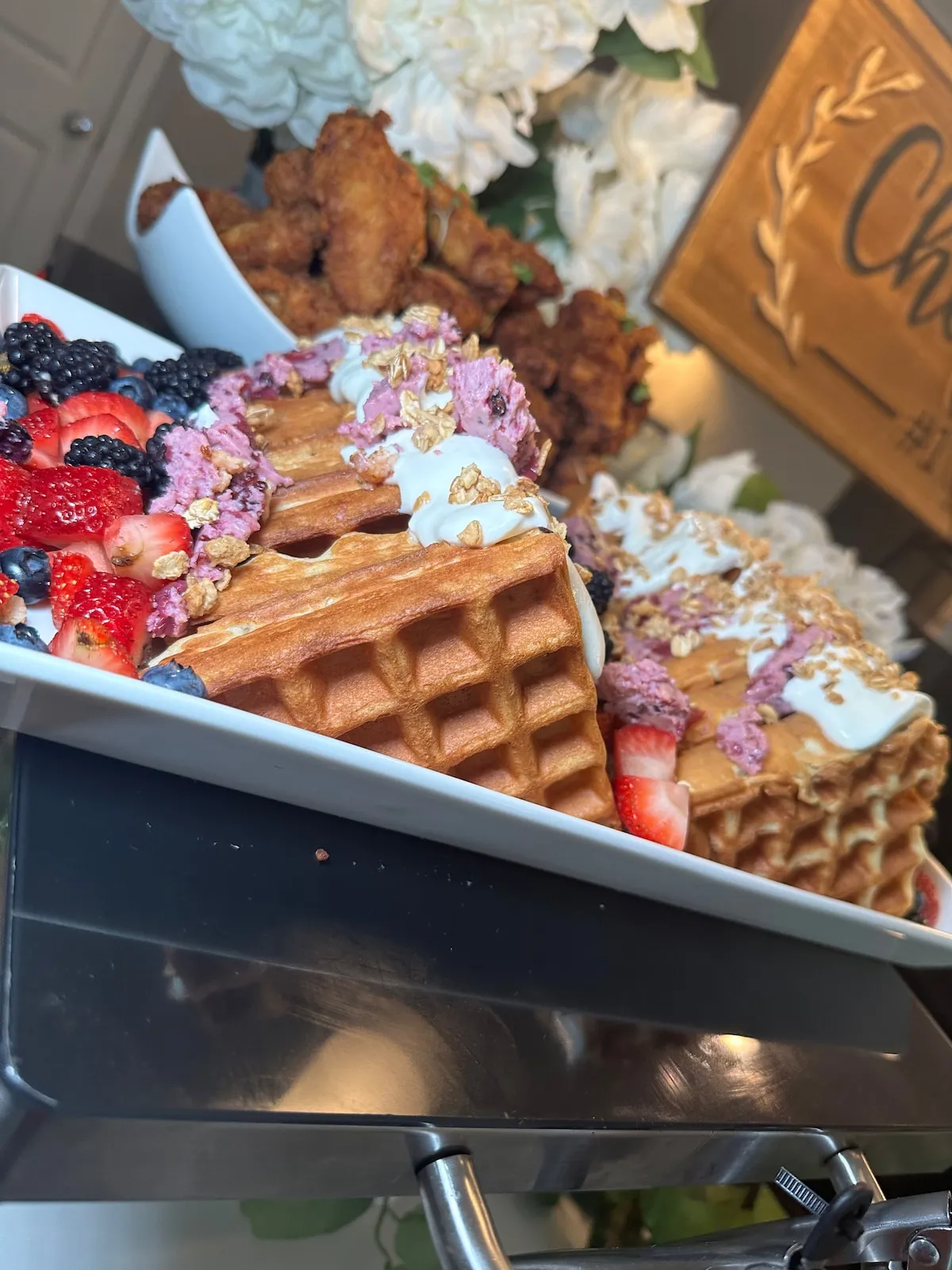 Waffles with berries on a brunch platter