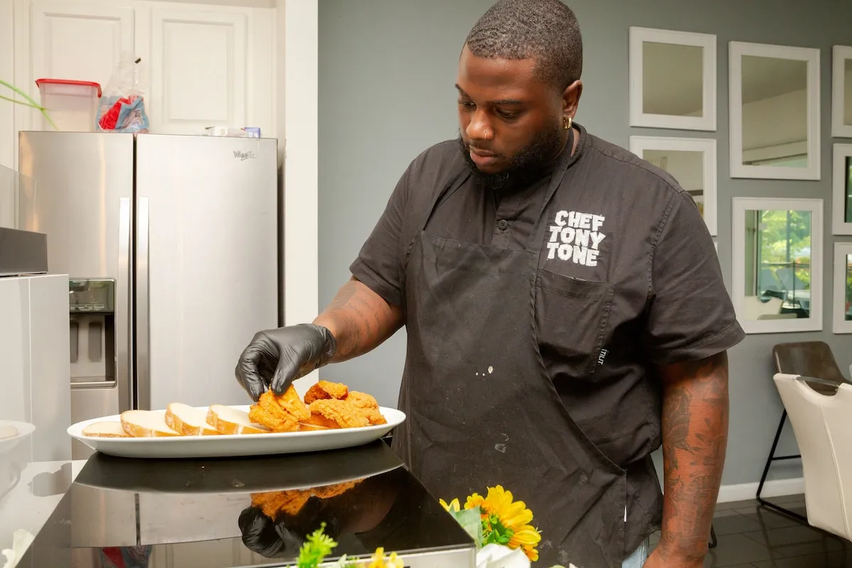 Tony plating fried fish