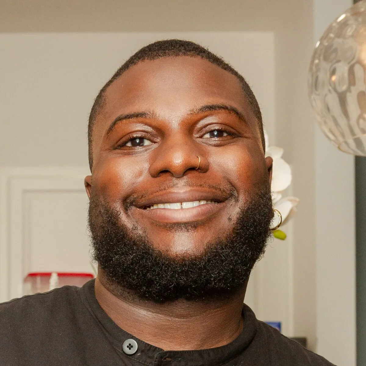Chef Tony Tone smiling in his kitchen
