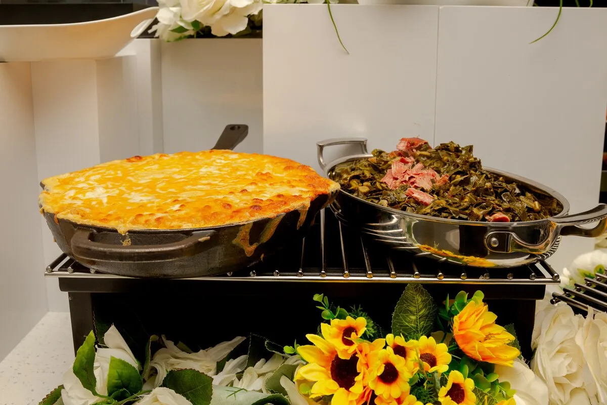 An event spread with sunflowers, white roses and a tower of onion rings